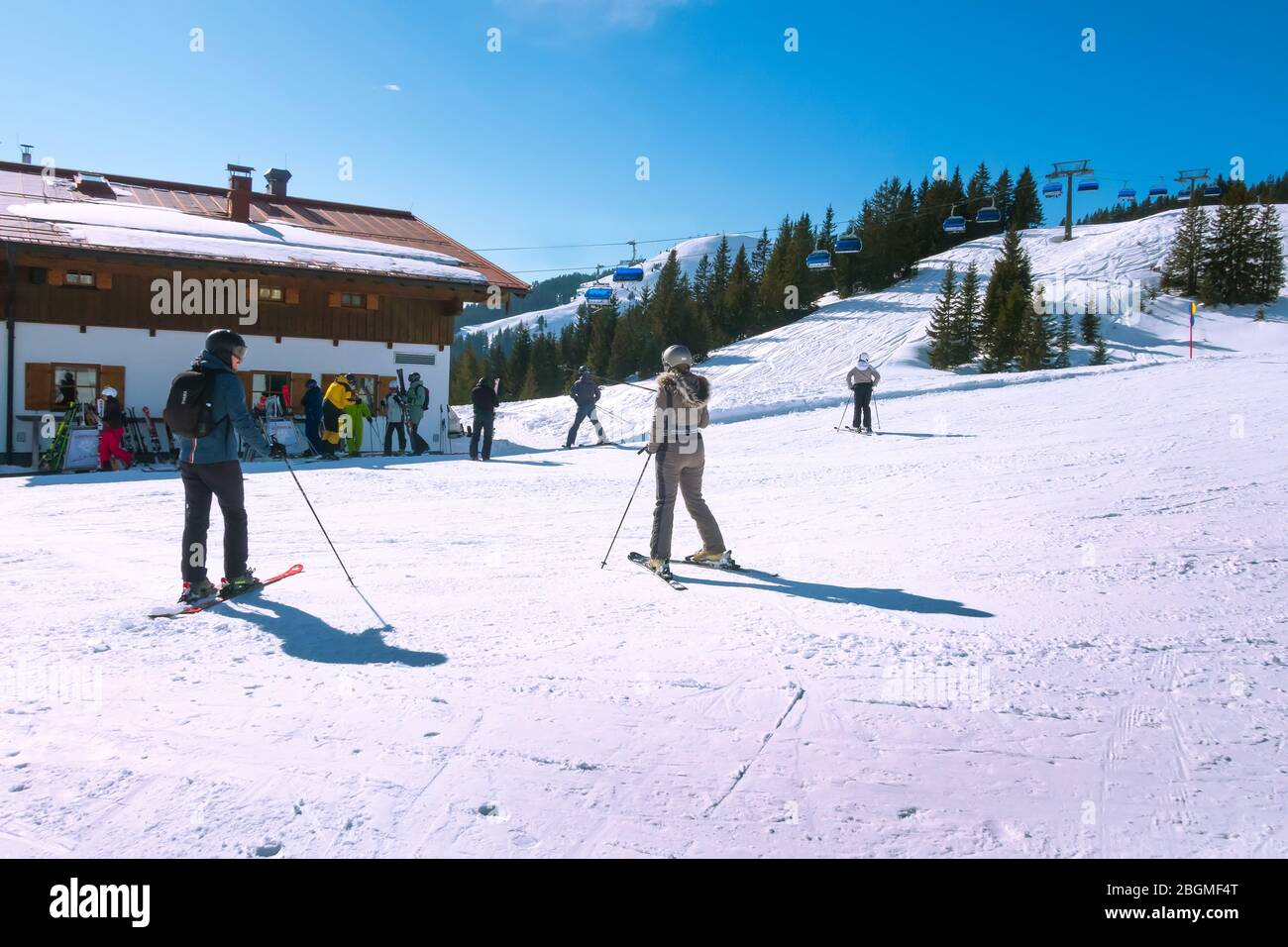 Saalbach-Hinterglemm, Austria - March 1, 2020: People skiing at ski slope of austrain winter resort Stock Photo
