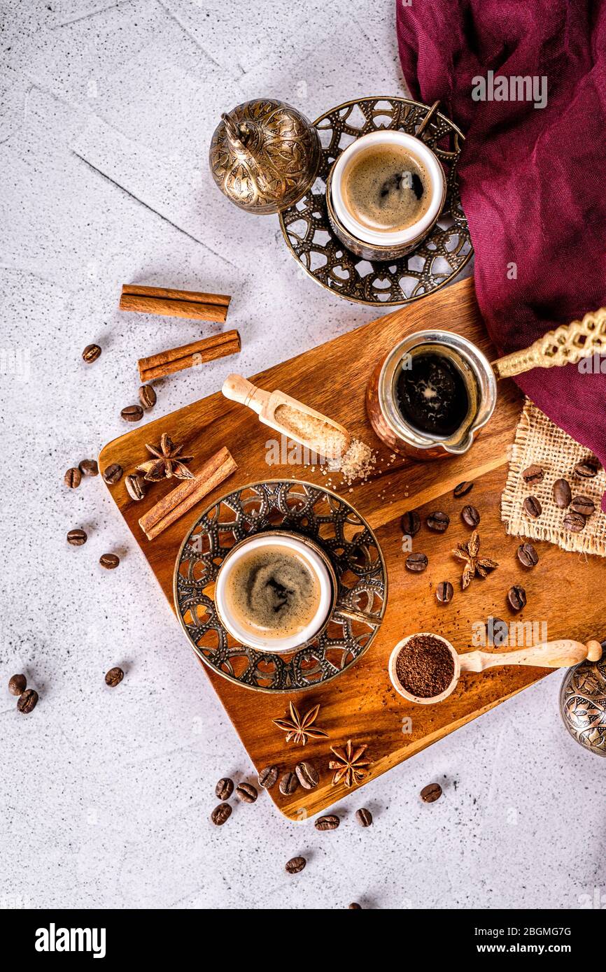 Arabic style coffee table with coffee cups, pot and beans Stock Photo