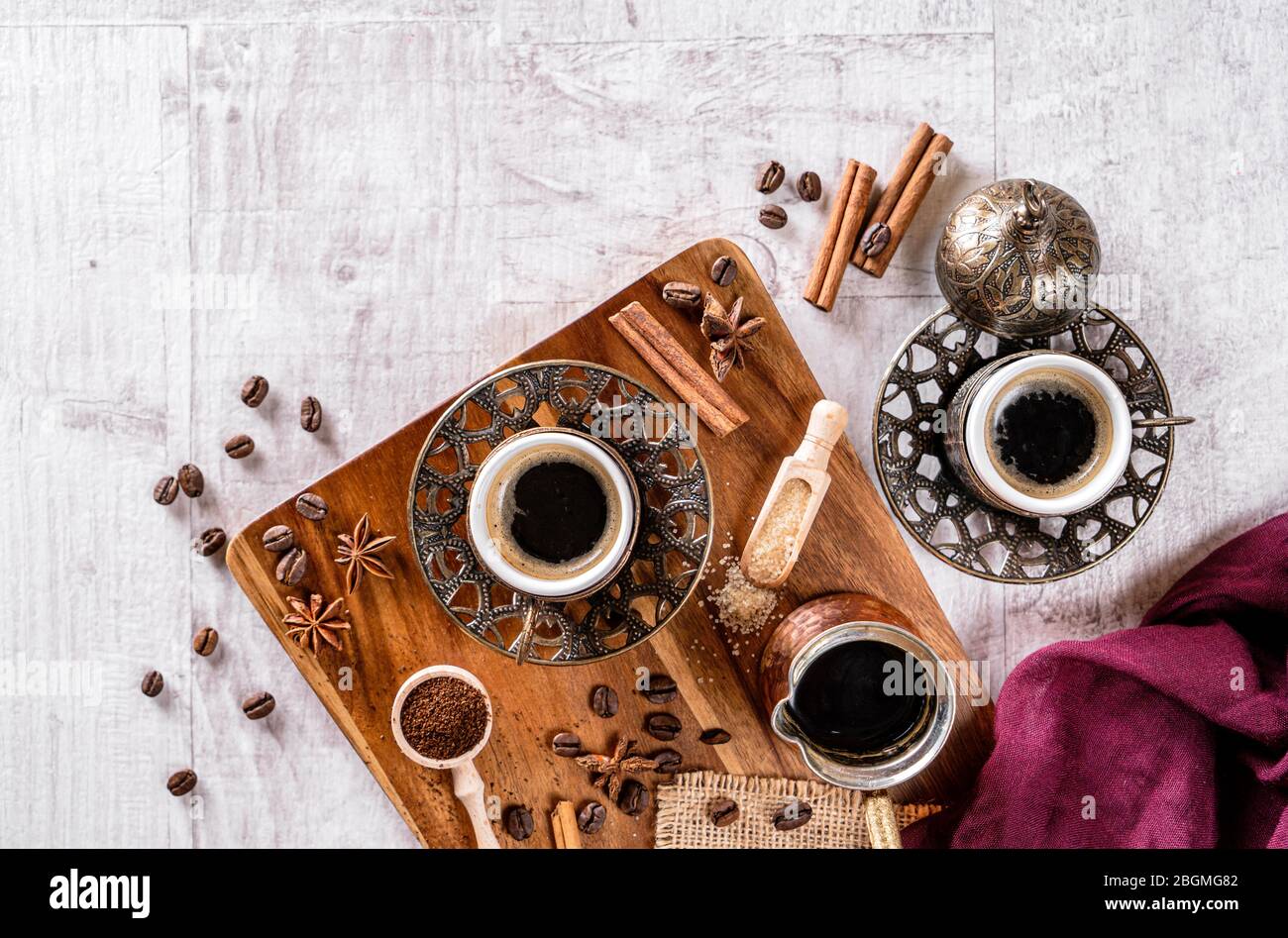 Cup of aromatic coffee drink and coffee beans on wooden background. Top view Stock Photo