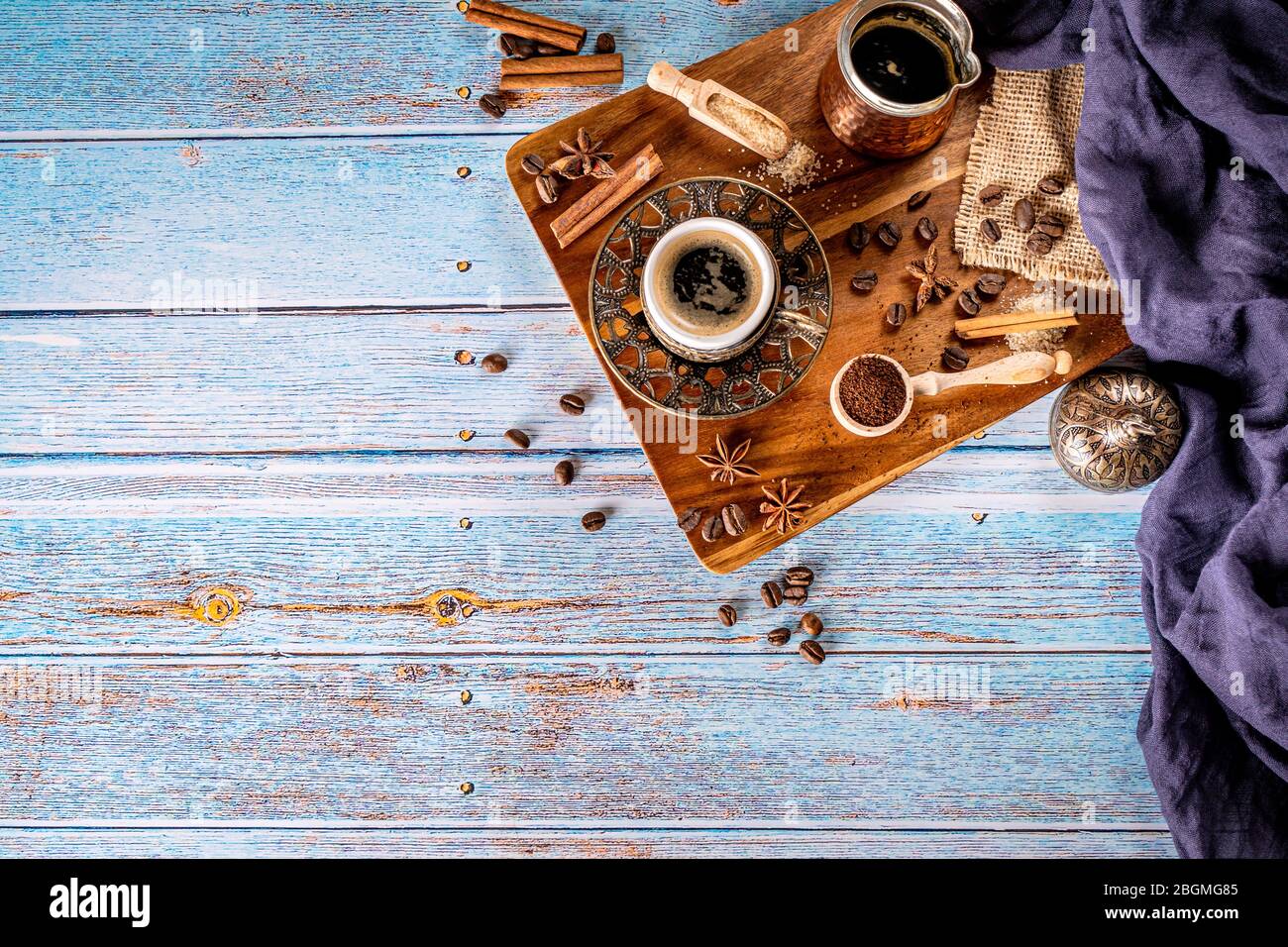 Traditional turkish coffee cup on aged blue wood background and copy space Stock Photo