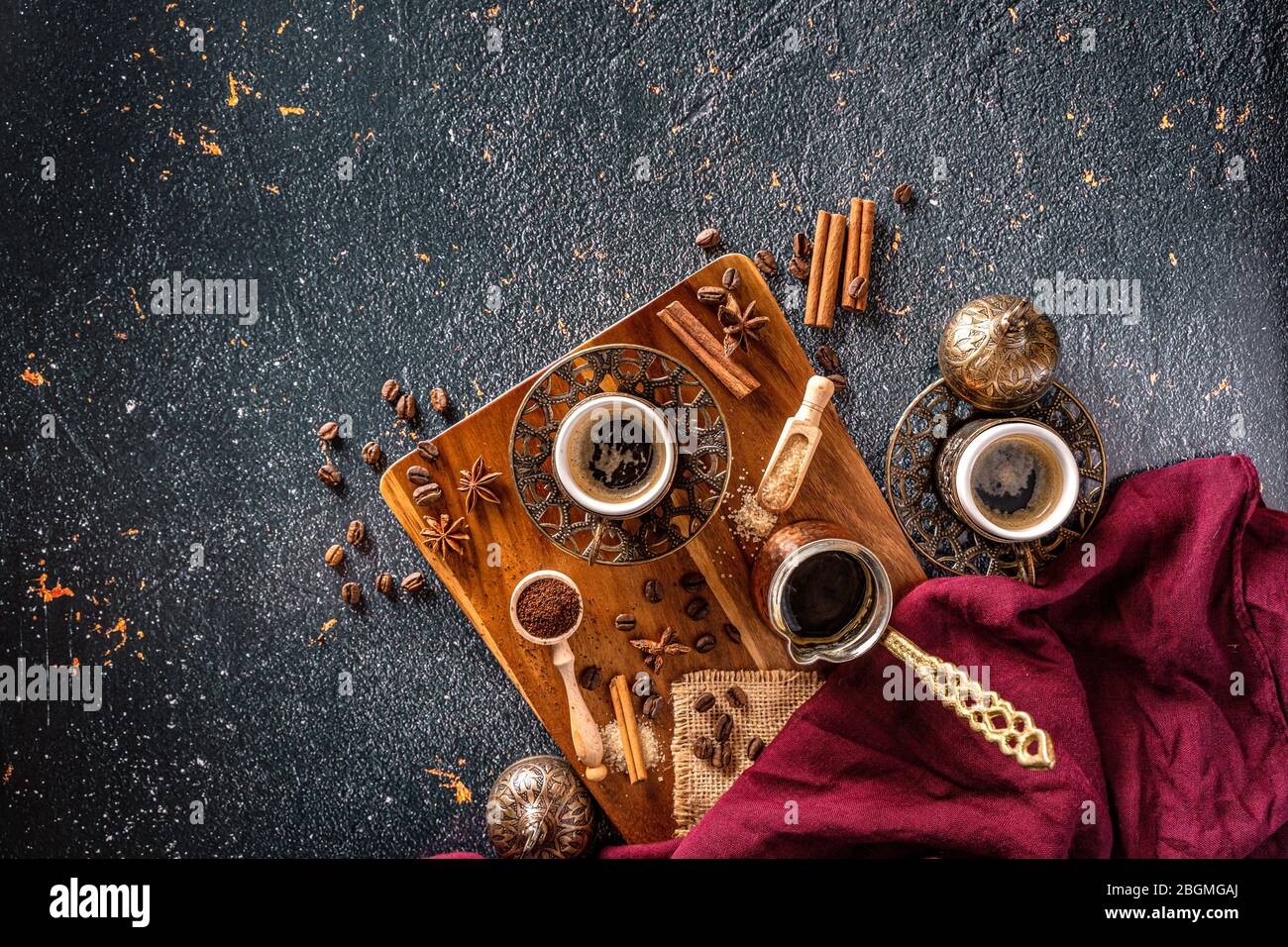 Top down coffee table with coffee cups, beans and coffee-pot on a black background with text space Stock Photo