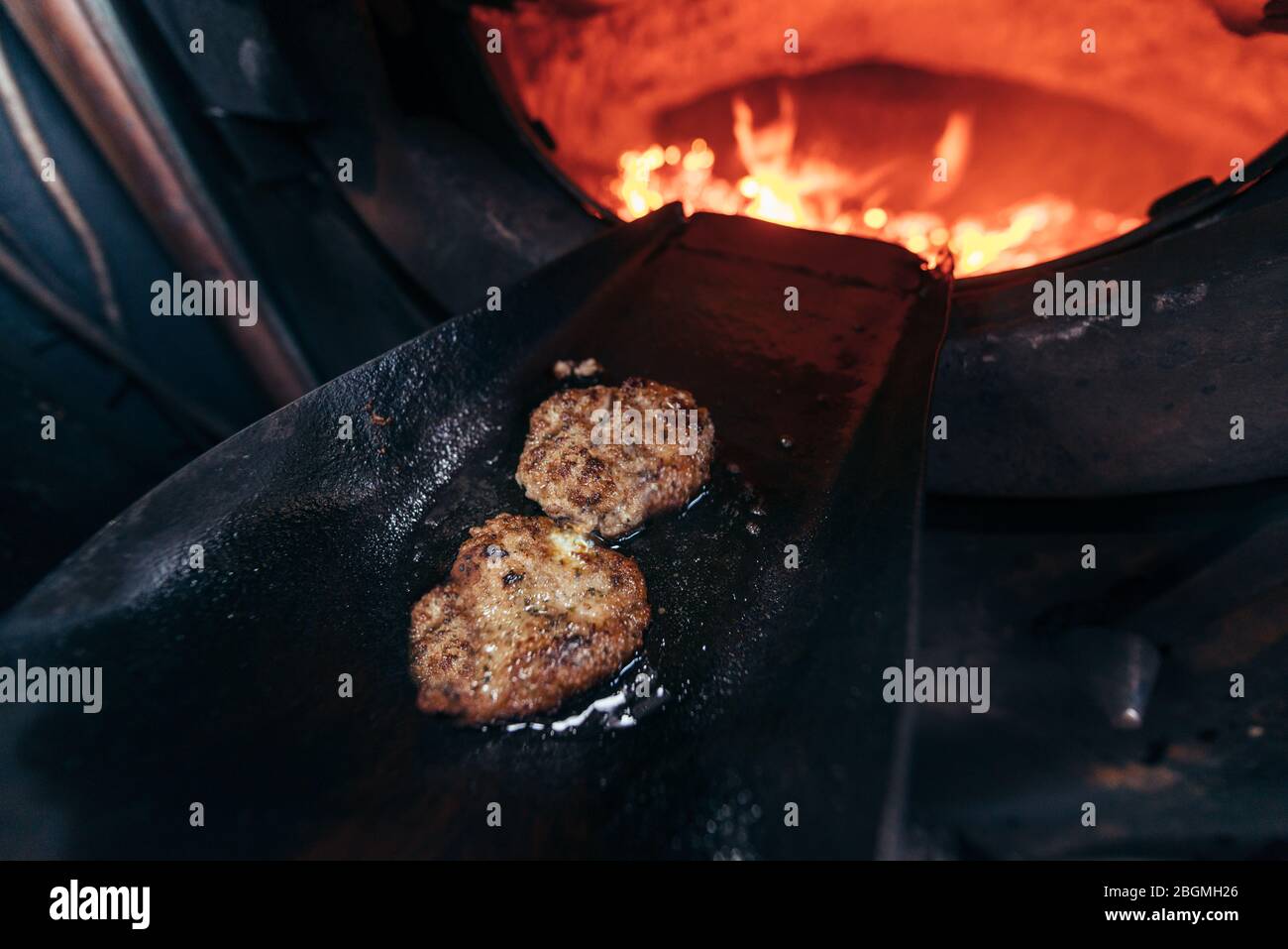 An oiled shove being usedl to cook food in the firebox   Working British steam locomotive, the Sir Nigel Gresley (LNER Class A4 Pacific 4498), in Brit Stock Photo