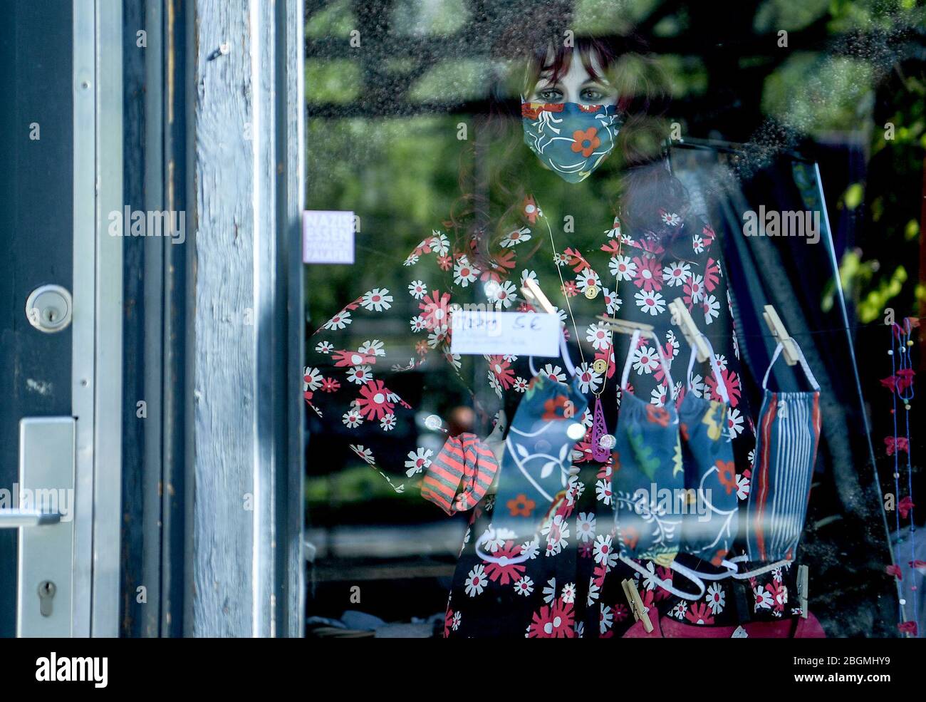 Berlin, Germany. 22nd Apr, 2020. A shop offers nose-mouth protection for sale in the shop window. Credit: Bernd von Jutrczenka/dpa/Alamy Live News Stock Photo