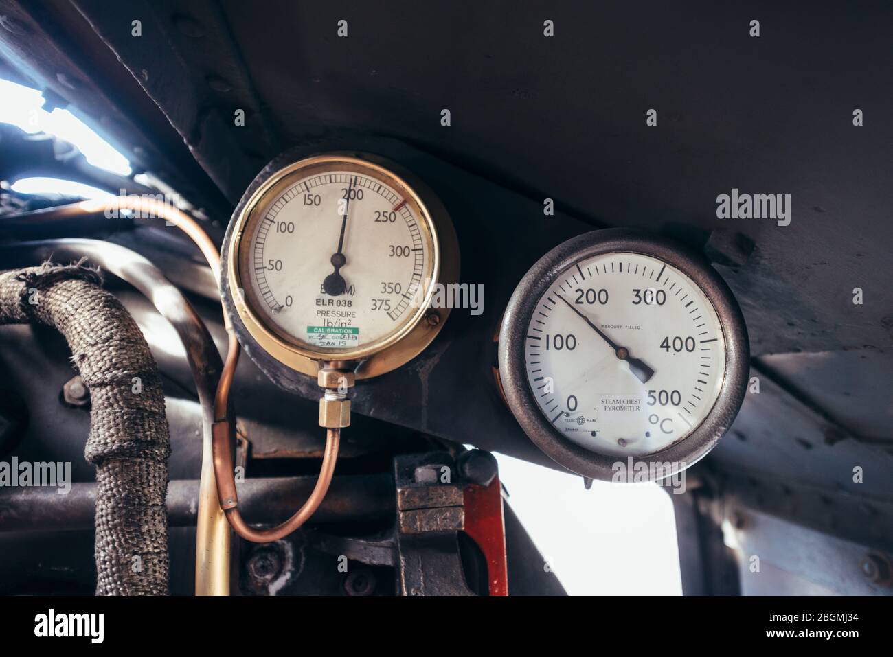 Brass dials inside the cab   Working British steam locomotive, the Sir Nigel Gresley (LNER Class A4 Pacific 4498), in British Railways (BR) blue liver Stock Photo