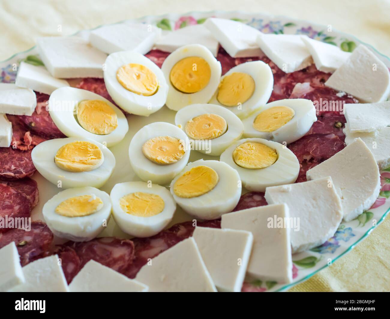 Neapolitan easter refreshment with eggs and salami Stock Photo Alamy