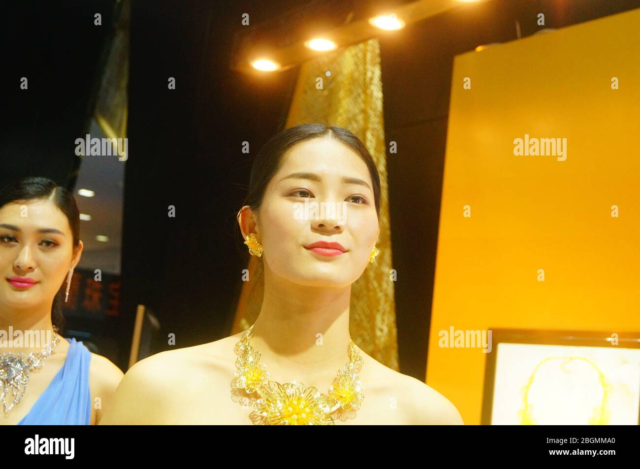 Female models display new gold jewelry Stock Photo Alamy