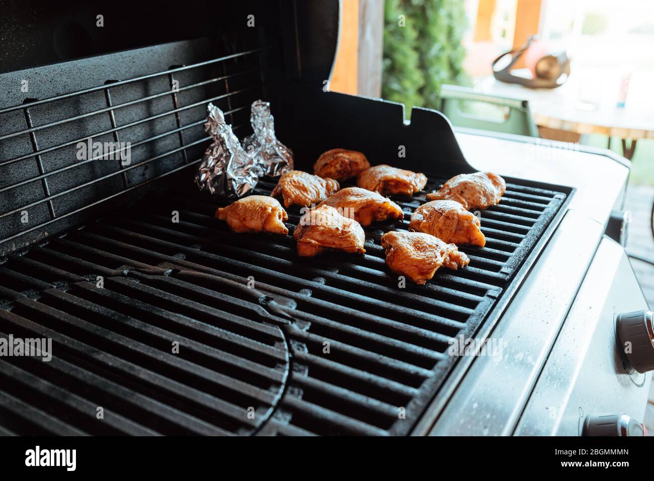 Grilled chicken legs on a gas grill Stock Photo Alamy