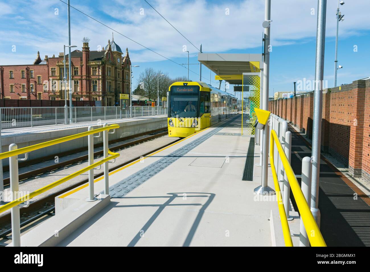 Metrolink tram at the Village stop on the opening day of the Trafford