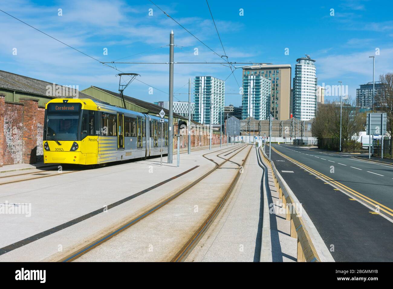 Metrolink tram and the tower blocks of MediaCityUK on the opening day