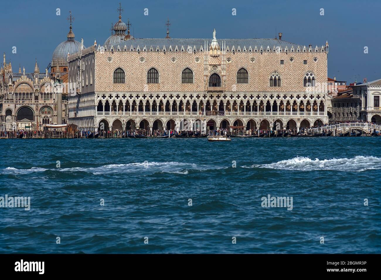 Doge's palace with the domes of St Mark's Cathedral, in front of the Grand Canal, Venice, Veneto, Italy Stock Photo
