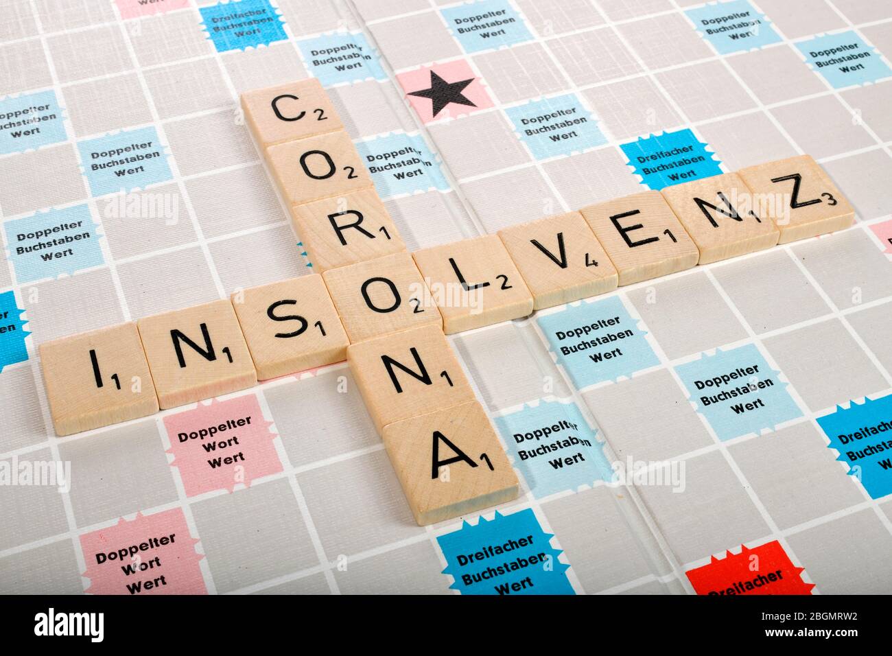 Letter game, symbolic image, letters form the words insolvency and corona, Corona crisis, Germany Stock Photo