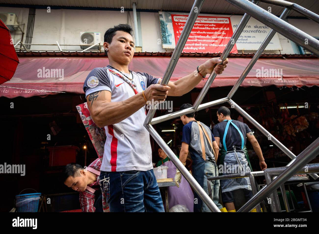 Men working at Khlong Toei Market, Bangkok, Thailand Stock Photo