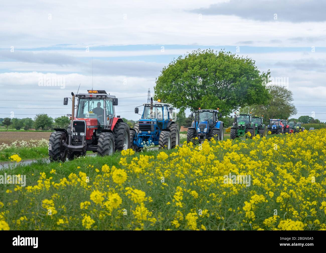 Farmer tractor driving wheel hires stock photography and images Alamy