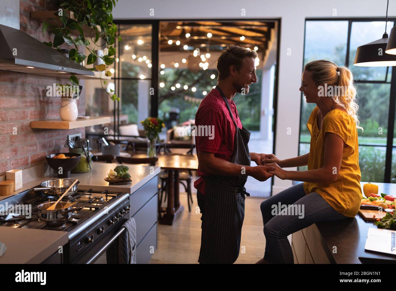 Caucasian couple spending time in the kitchen Stock Photo