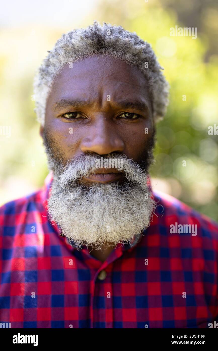 Portrait of a senior African American man enjoying his time at the garden Stock Photo