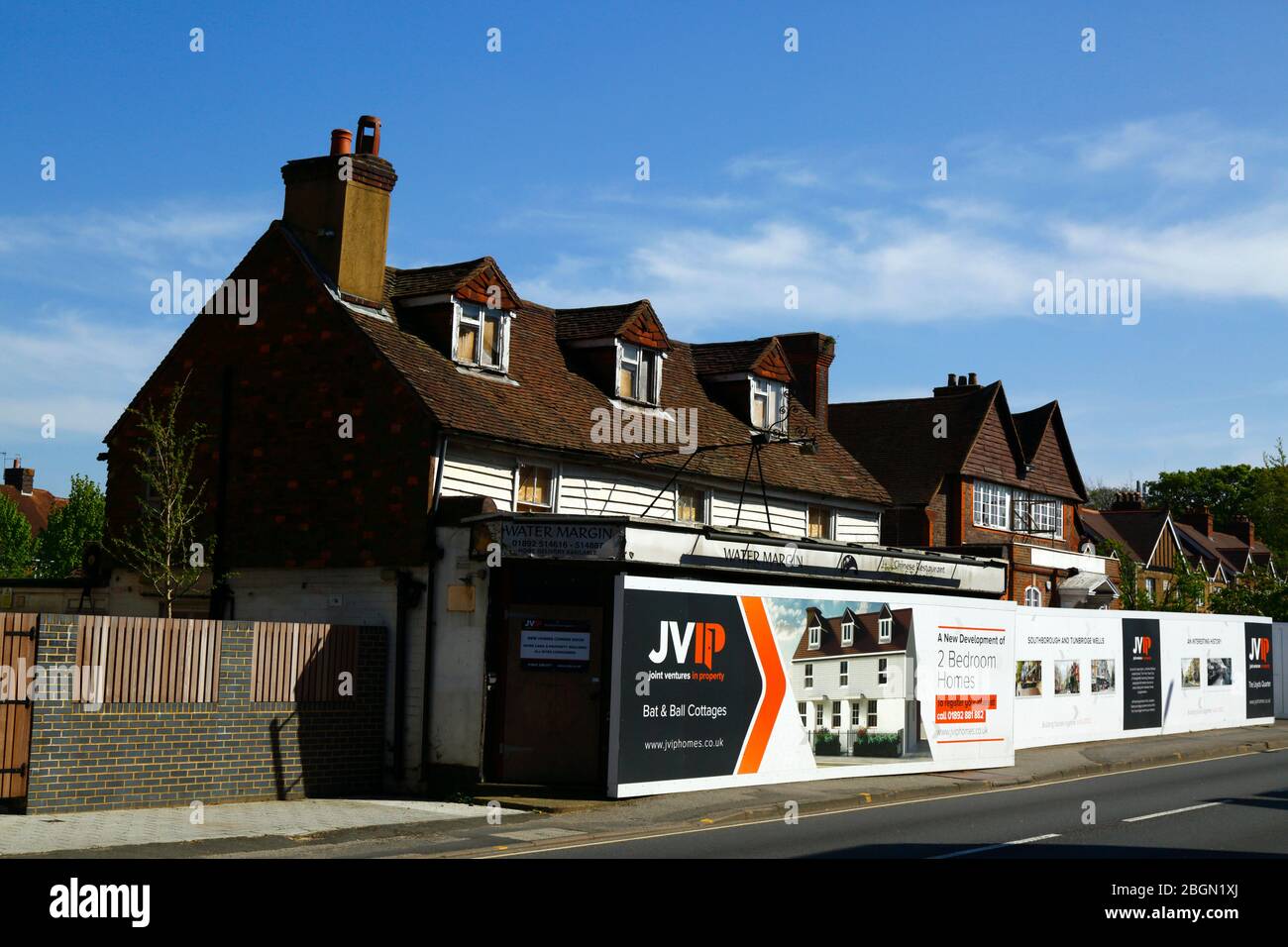 Signs outside project to convert the former Bat and Ball pub into cottages, Southborough, Kent, England Stock Photo