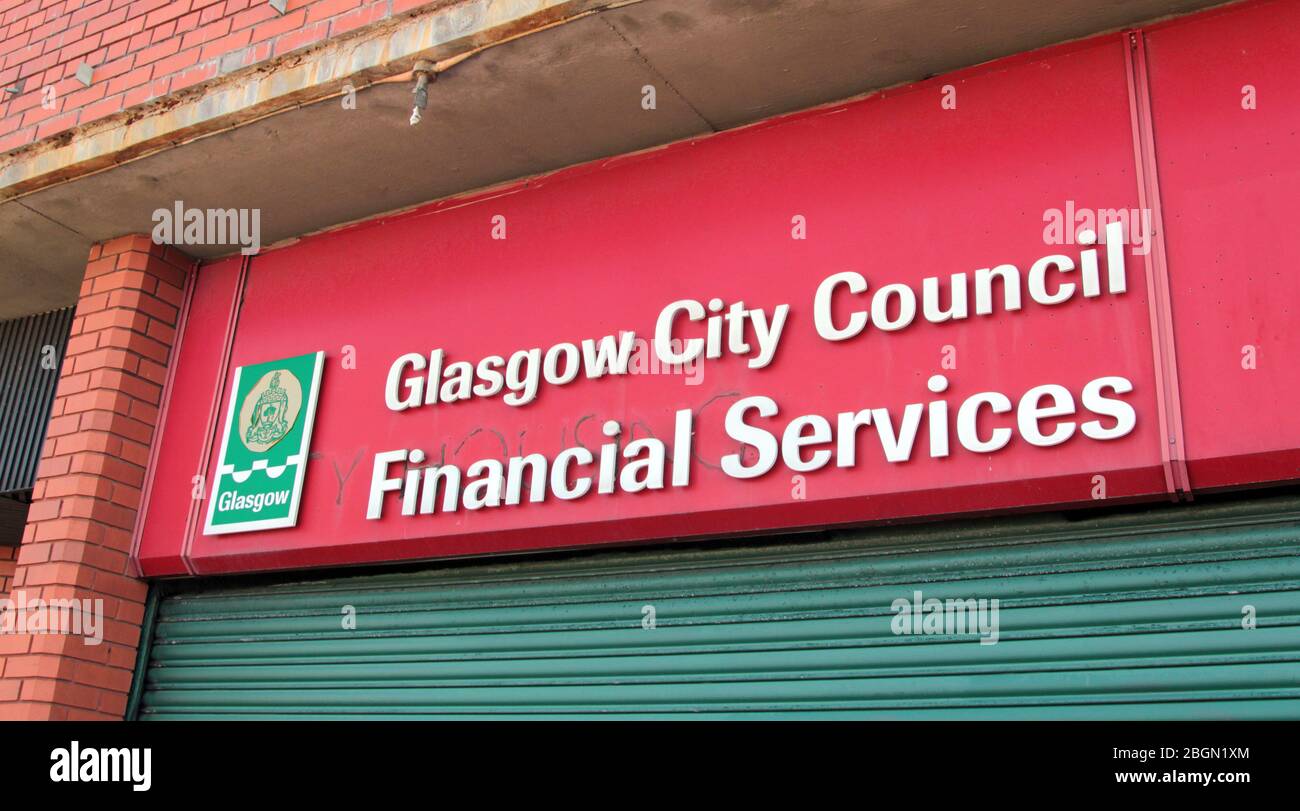 A sign over the offices of Glasgow City Councils Financial Services where they advise and help with council tax, housing benefit and rent problems. Glasgow 2020. ALAN WYLIE/ALAMY© Stock Photo