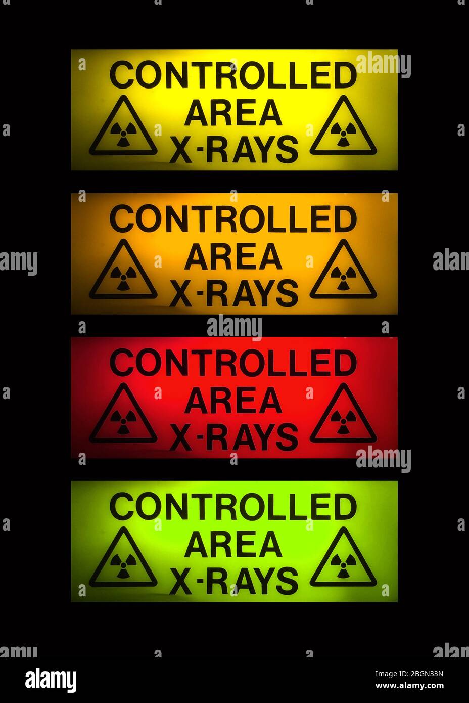 X-Rays sign in 4 different colours on black Stock Photo