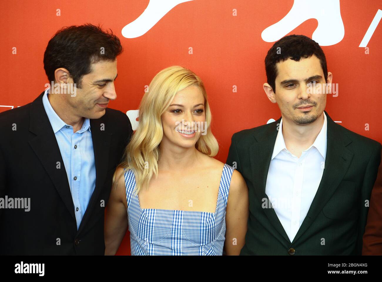VENICE, ITALY - AUGUST 29: Josh Singer, Olivia Hamilton and Damien Chazelle attends the 'First Man' photocall during the 75th Venice Film Festival Stock Photo