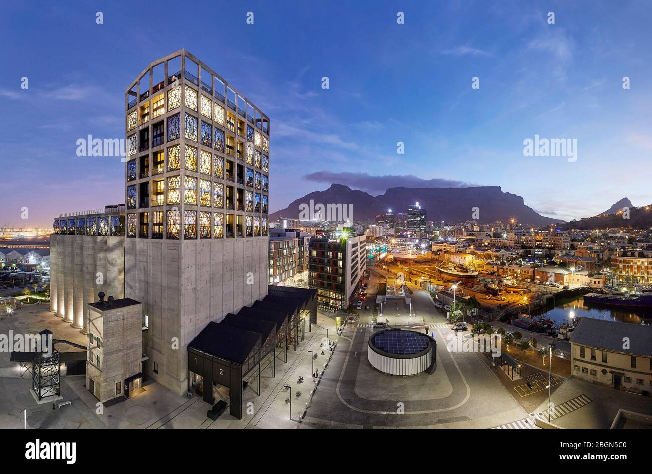 Elevated oblique view of exterior facade at dusk. Zeitz MOCAA, Cape