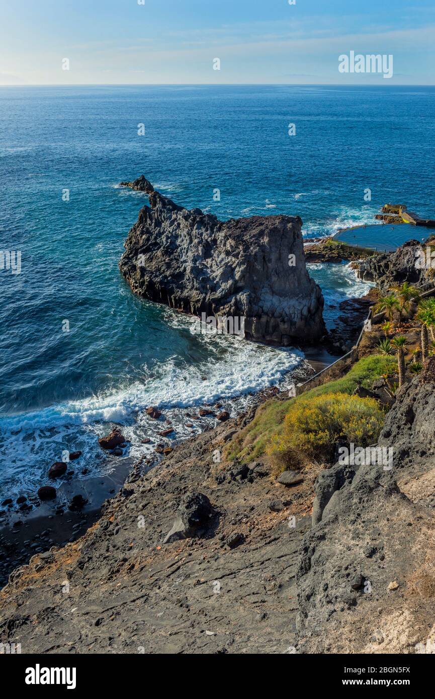 Rocky promontory in the Atlantic Ocean, Santiago del Teide, Tenerife, Canary Islands, Spain Stock Photo