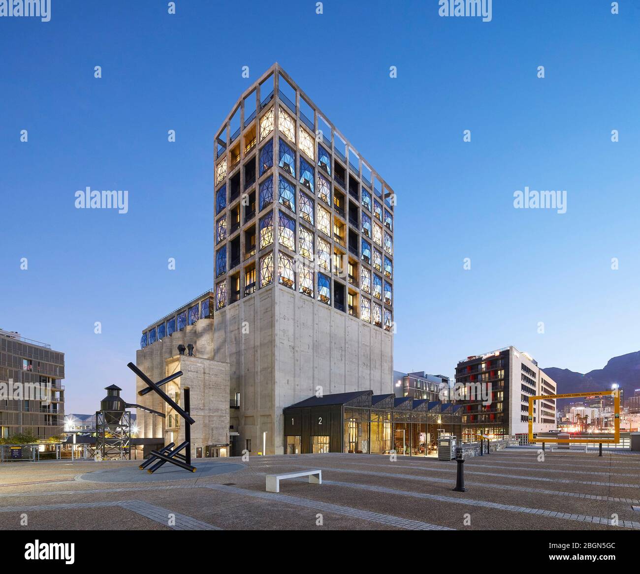 Exterior facade across plaza with canopied Track Shed forecourt. Zeitz MOCAA, Cape Town, South Africa. Architect: Heatherwick Studio, 2017. Stock Photo