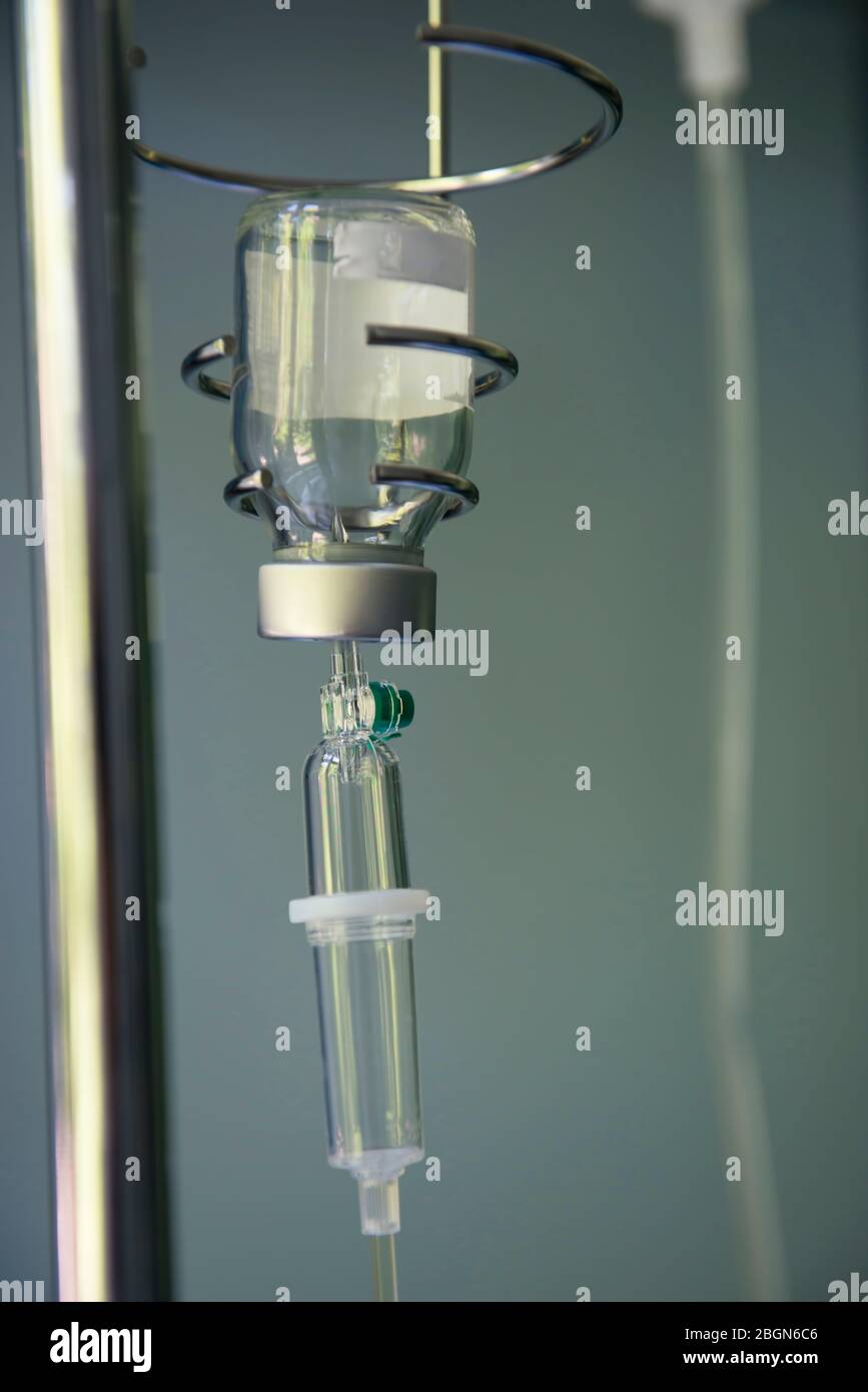 Saline drip support stand. Bottle with solution for intravenous