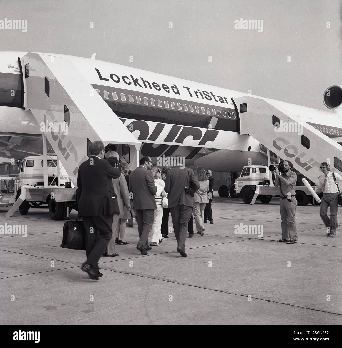 1973, historical, television cameras filming passengers boarding a
