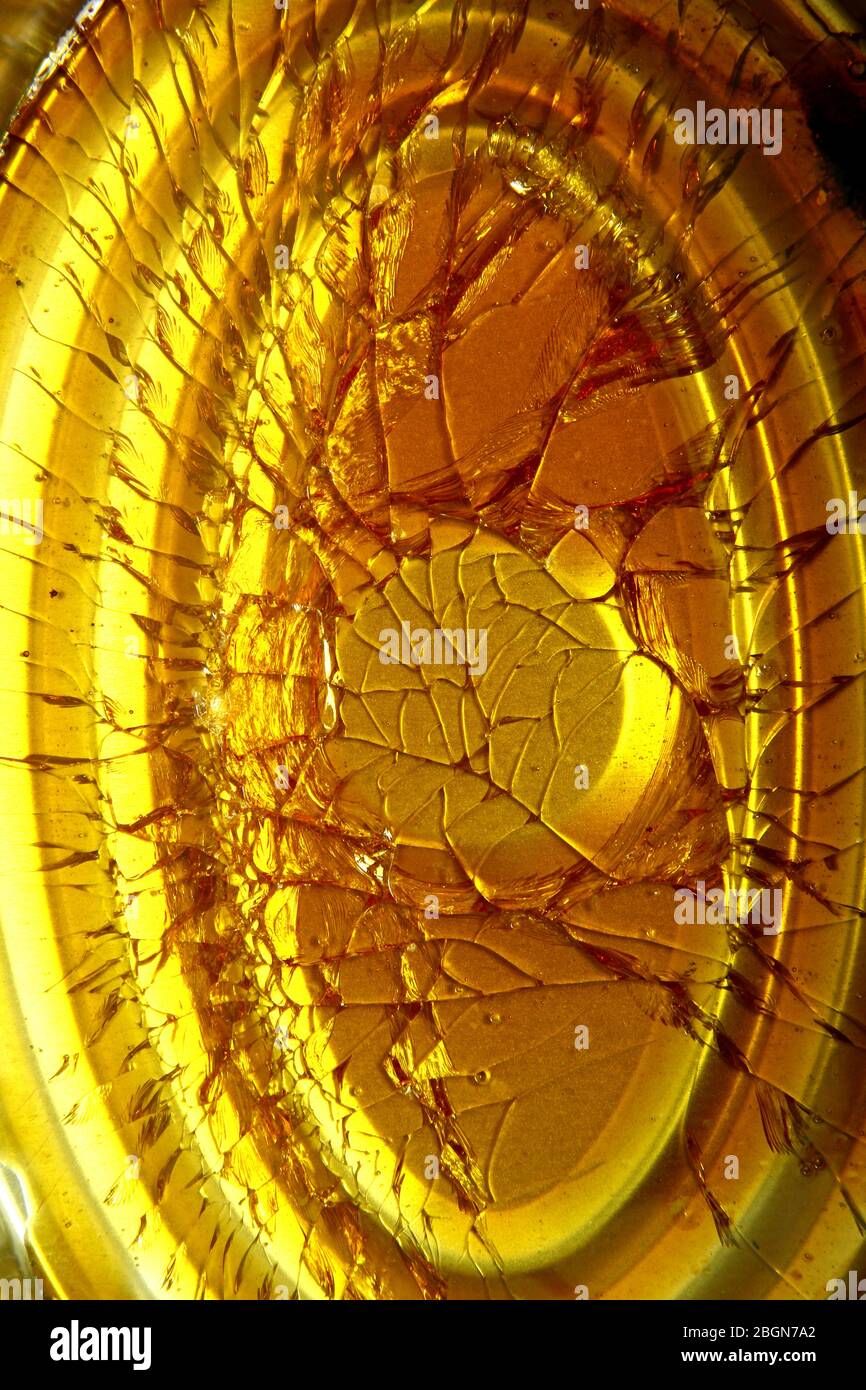 Close up photo of cracked and hardened caramel syrup at the bottom of a