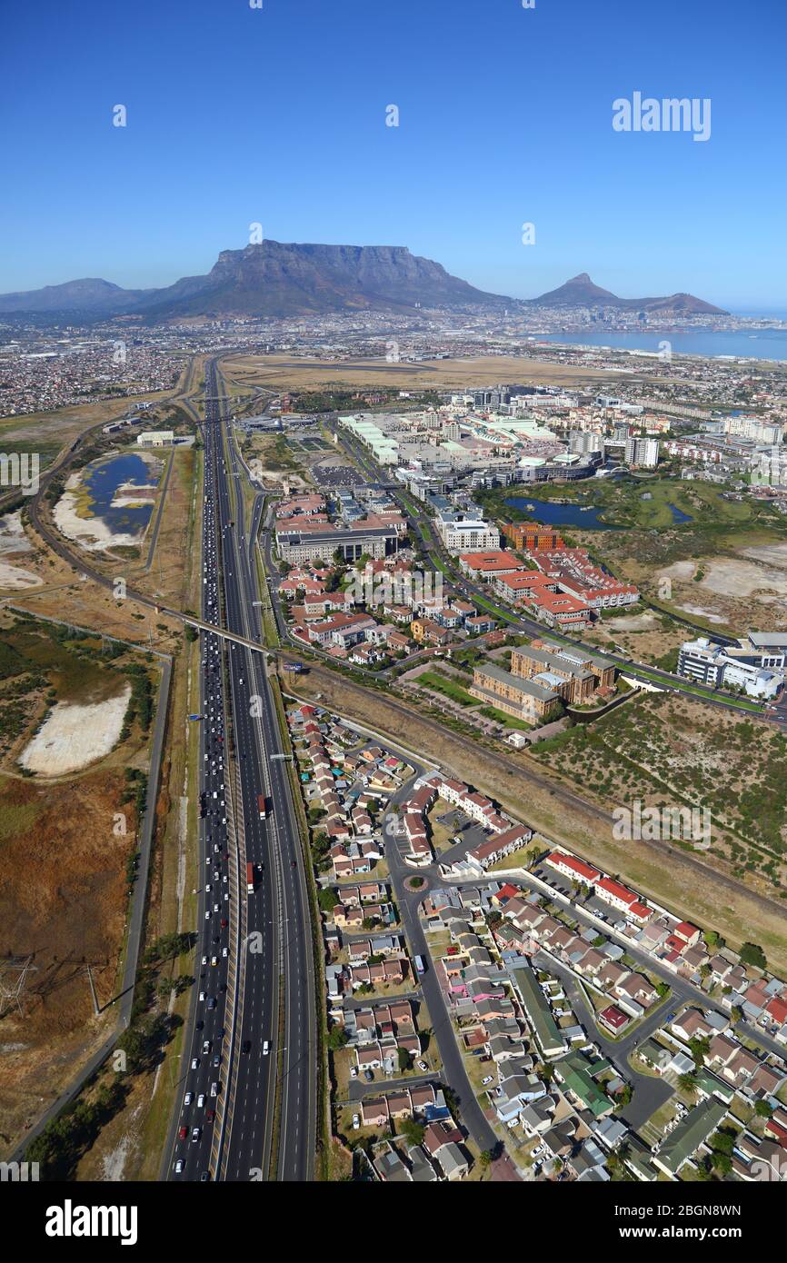 Aerial photo of Century City and N1 highway with Table Mountain and Cape Town CBD in the background Stock Photo