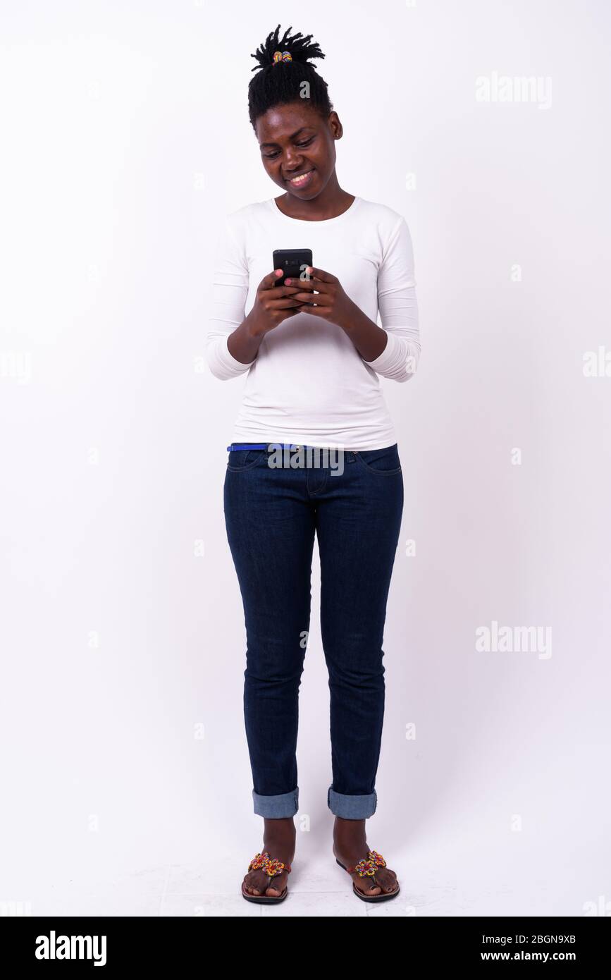 Full body shot of young beautiful African woman Stock Photo