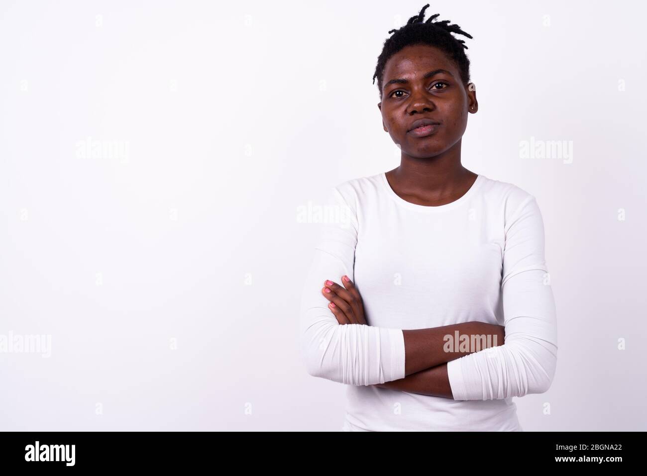 Portrait of young beautiful African woman with arms crossed Stock Photo ...
