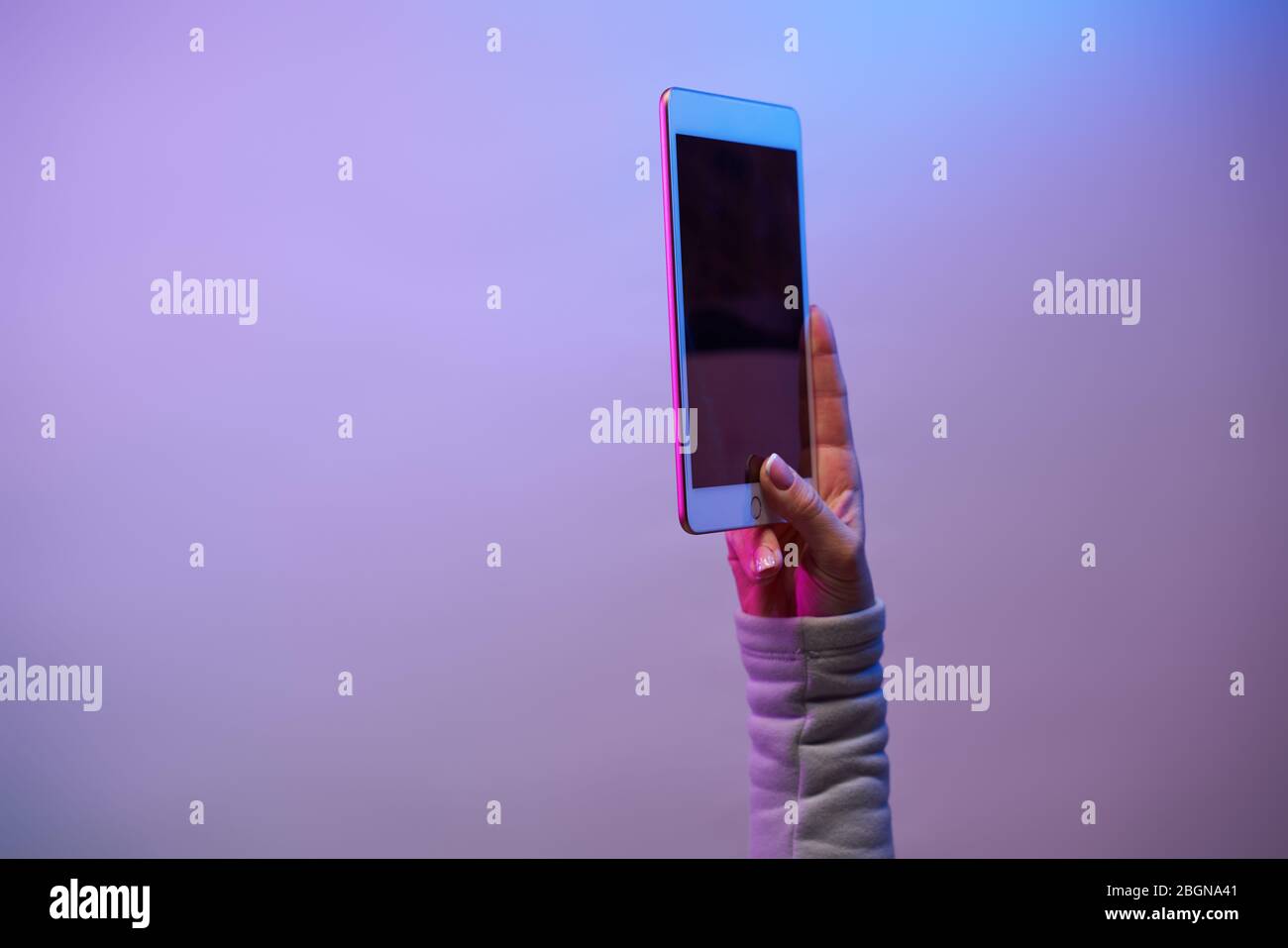 Close-up of man's hands with smartphone and blank black screen on blank ...