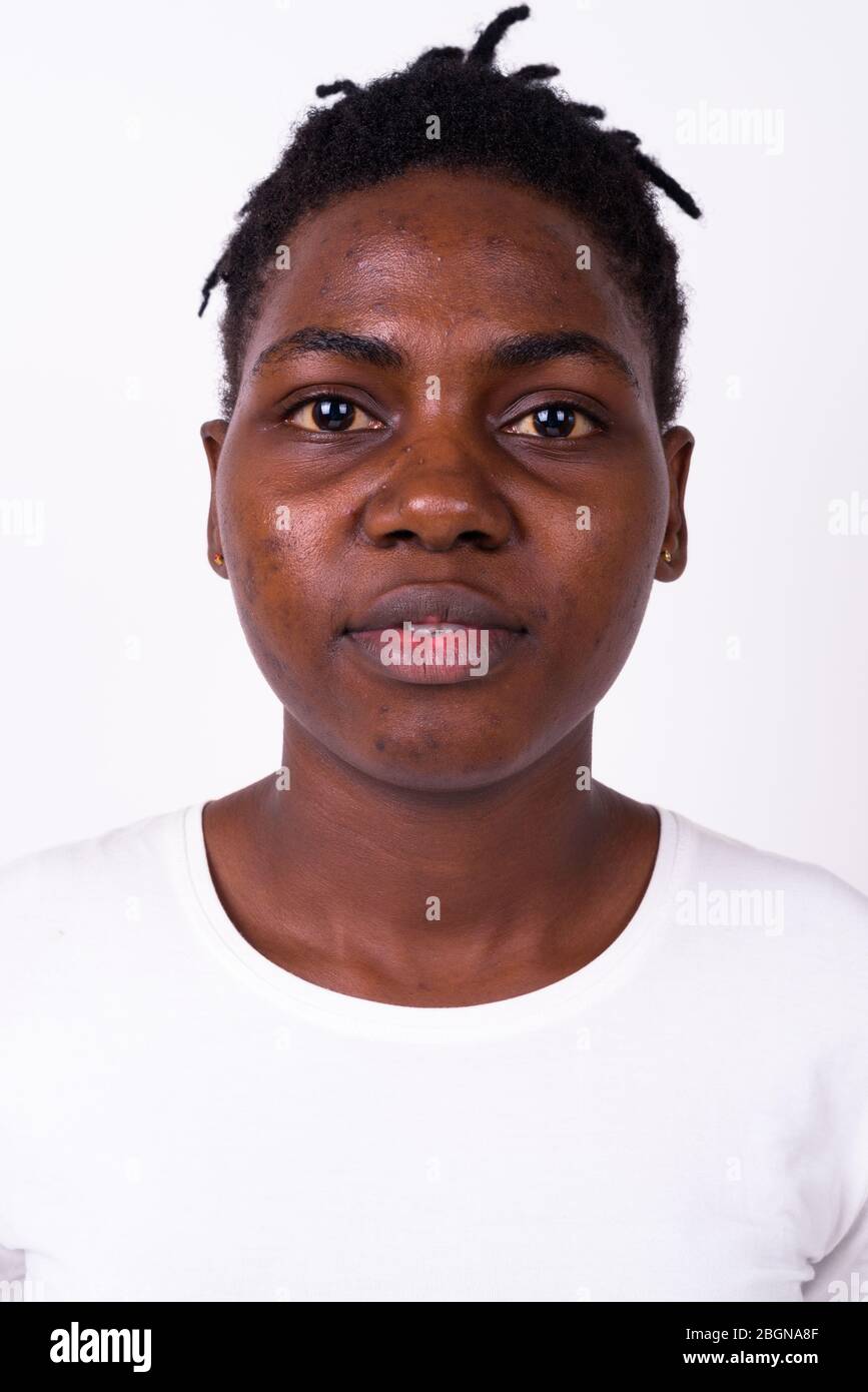 Face of young beautiful African woman looking at camera Stock Photo - Alamy