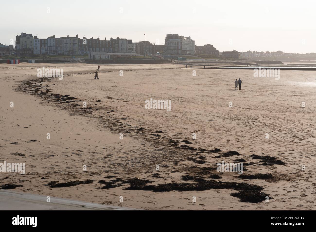 People social distancing while taking daily exercise in lockdown Margate during the Covid-19 global pandemic Stock Photo