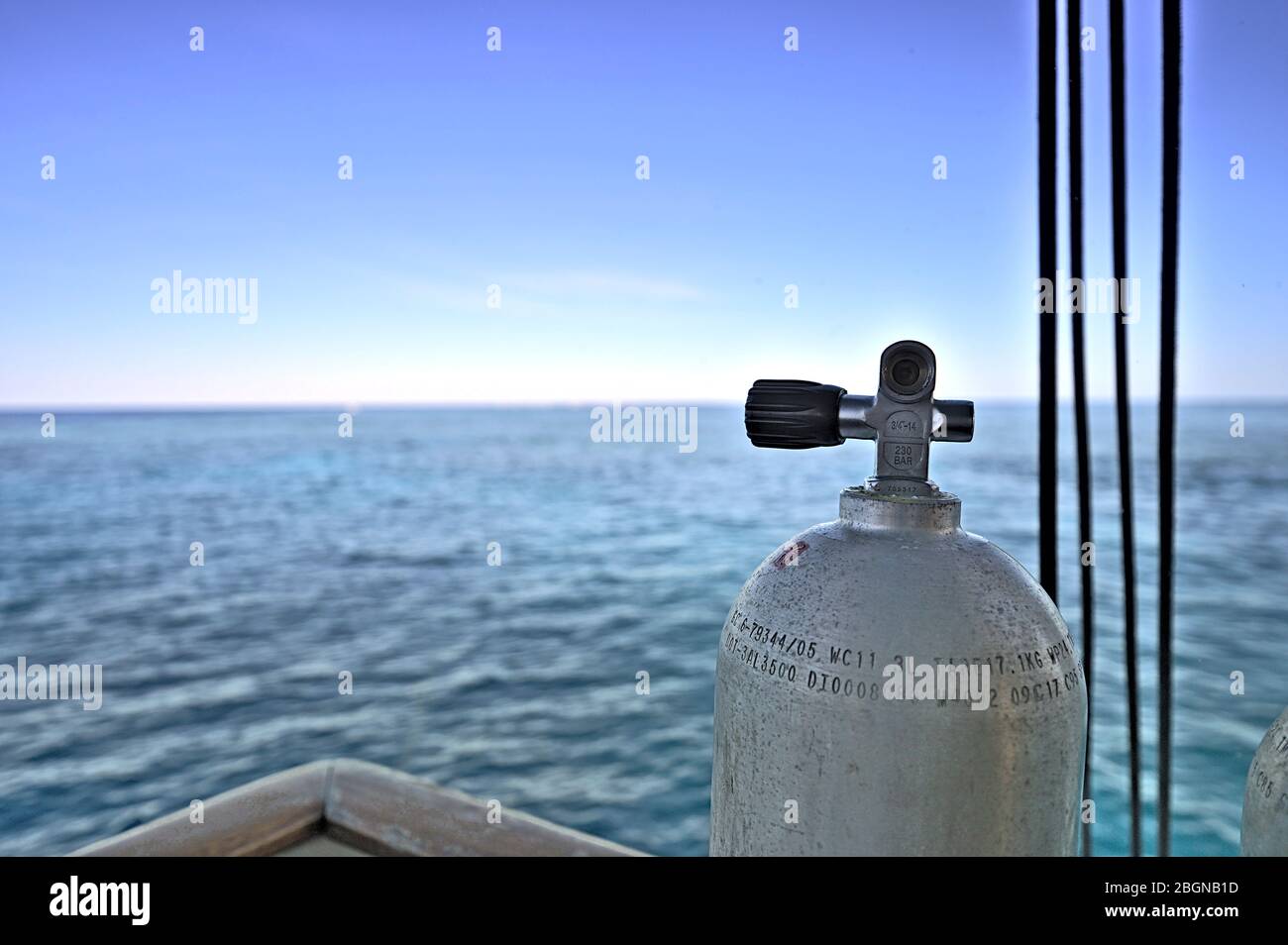 Tank on a dive boat with view on the Great Barrier Reef Stock Photo