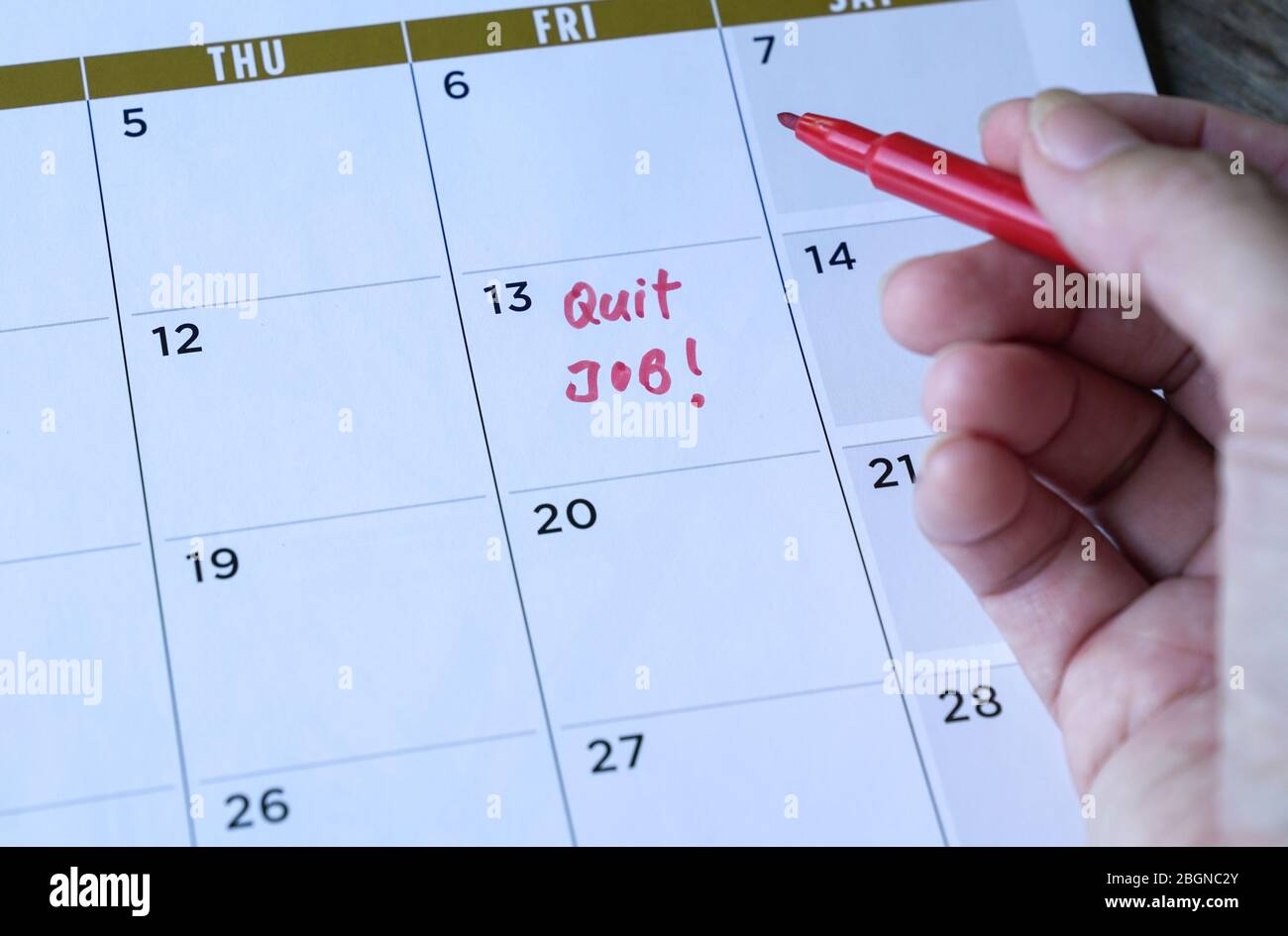 Quit job words written on table calendar with red marker. Employment or careers concept. Stock Photo