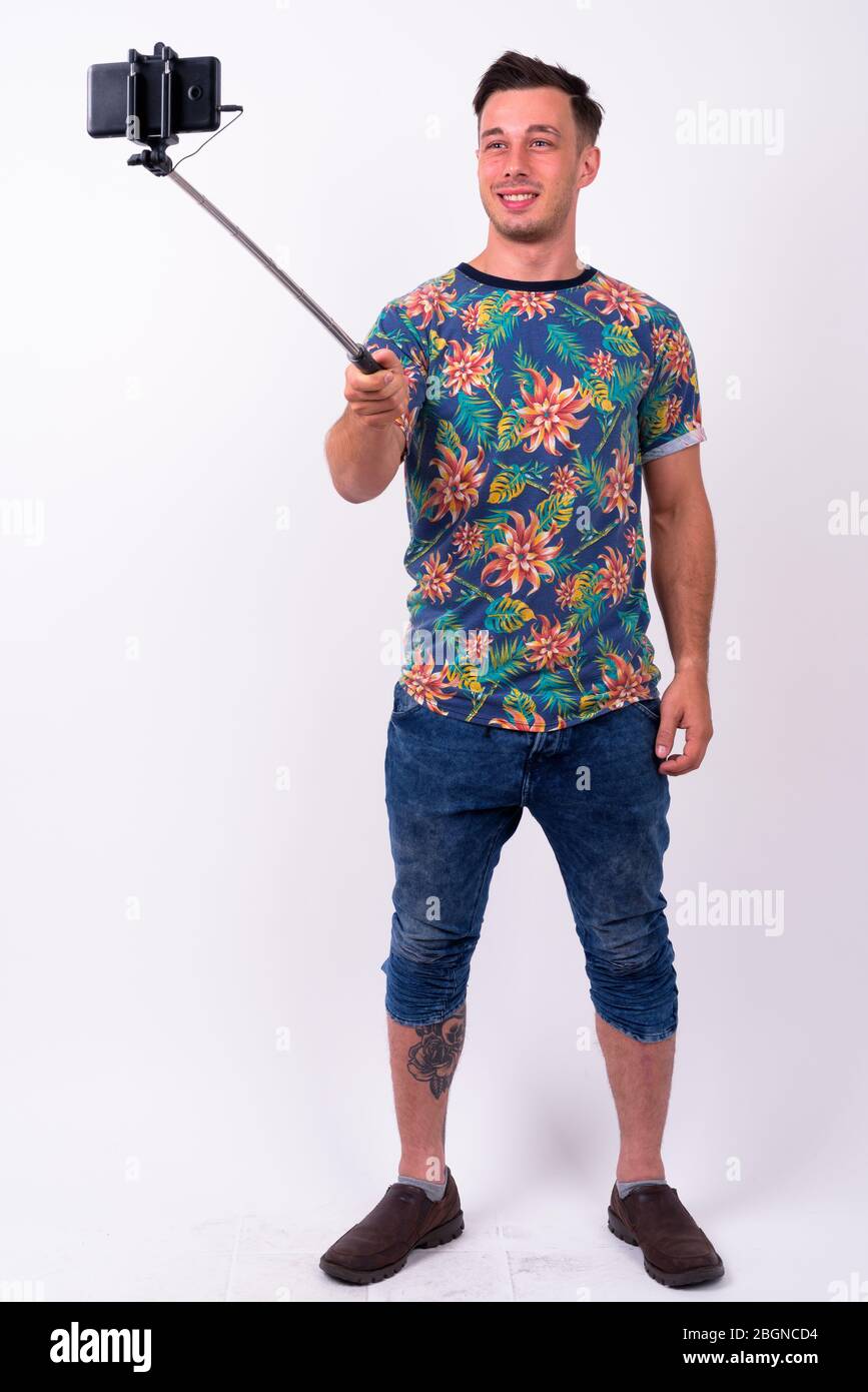 Full body shot of young handsome tourist man Stock Photo - Alamy
