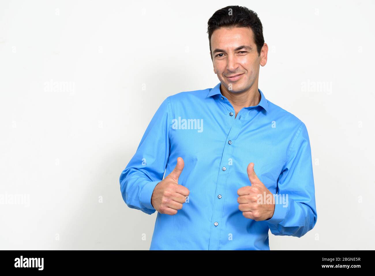 Portrait of happy mature handsome businessman giving thumbs up Stock ...