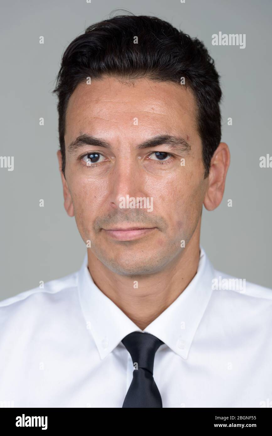 Face of mature handsome businessman looking at camera Stock Photo - Alamy