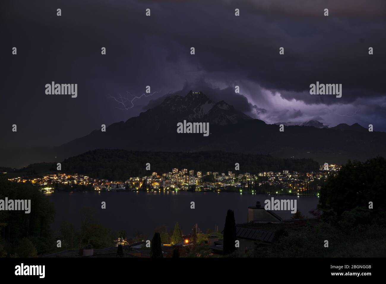 Thunderstorm with lightnings over the Mount Pilatus in Lucerne, Switzerland, illuminate the night sky /Gewitter über dem Pilatus in Luzern mit Blitzen Stock Photo