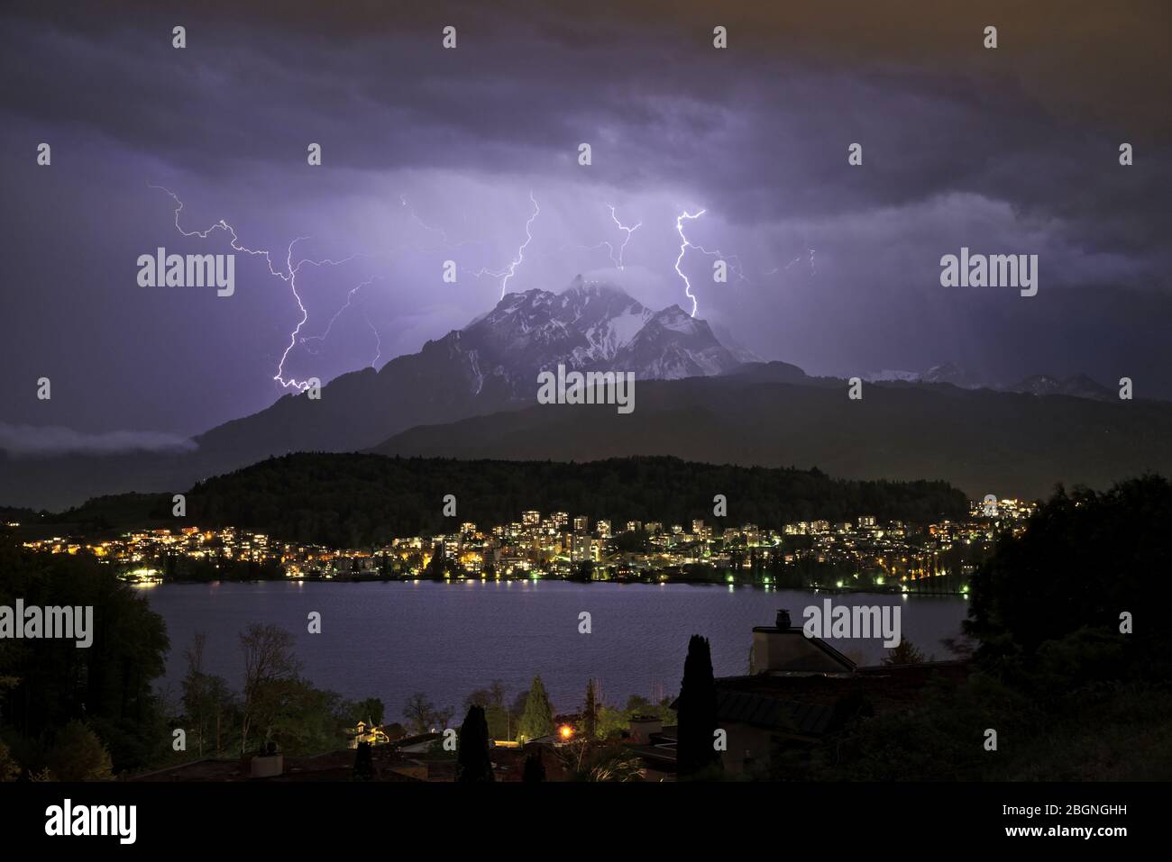Thunderstorm with lightnings over the Mount Pilatus in Lucerne, Switzerland, illuminate the night sky /Gewitter über dem Pilatus in Luzern mit Blitzen Stock Photo