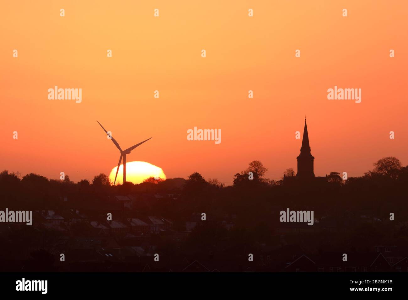A golden sun rising behind St Mary's Church in Garforth & Hook Moor ...