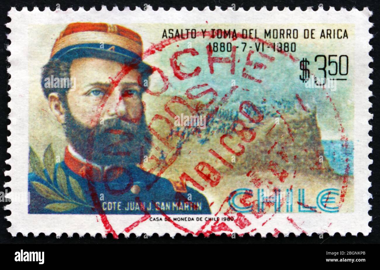CHILE - CIRCA 1980: a stamp printed in the Chile shows Commander Juan J. San Martin, Battle Scene, Painting by Pedro Subercaseaux, Battle of Morro de Stock Photo