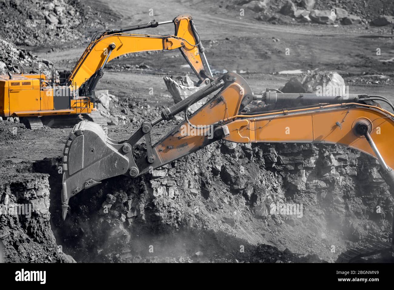 Excavator work loading of coal into Yellow mining truck. Open pit mine ...