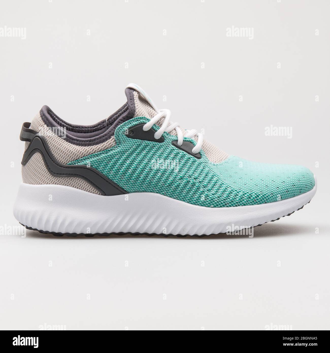 VIENNA, AUSTRIA - AUGUST 16, 2017: Adidas Alphabounce Lux green, beige and  white sneaker on white background Stock Photo - Alamy