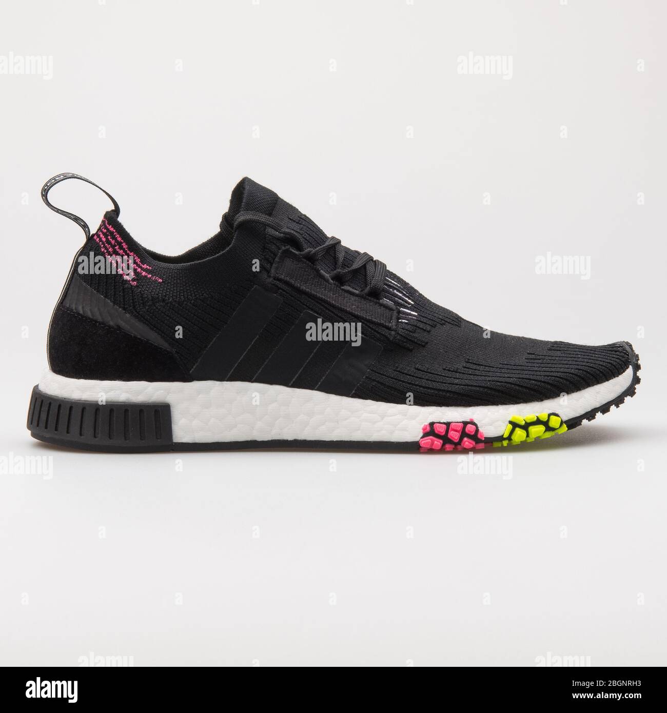 grådig Countryside Blind tillid VIENNA, AUSTRIA - AUGUST 24, 2017: Adidas NMD Racer PK Primeknit Core  black, pink and yellow sneaker on white background Stock Photo - Alamy