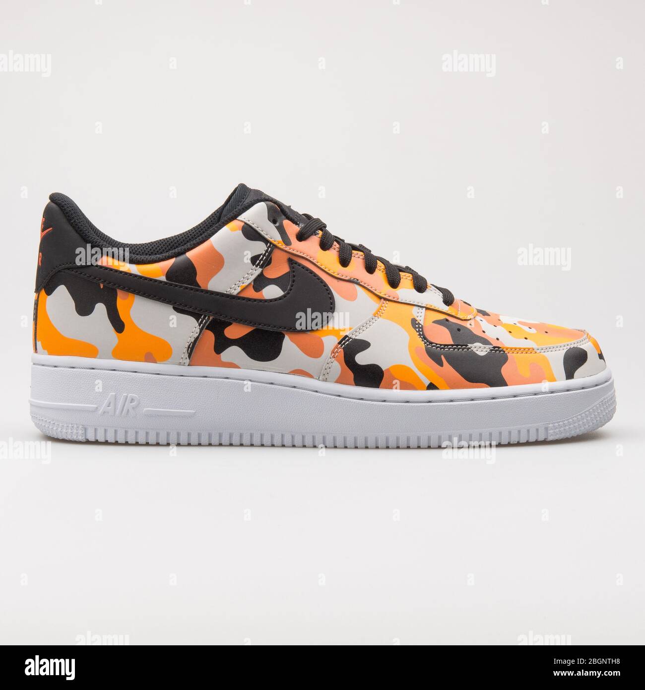 VIENNA, AUSTRIA - AUGUST 24, 2017: Nike Air Force 1 07 LV8 orange, white and black sneaker on white Stock Photo -