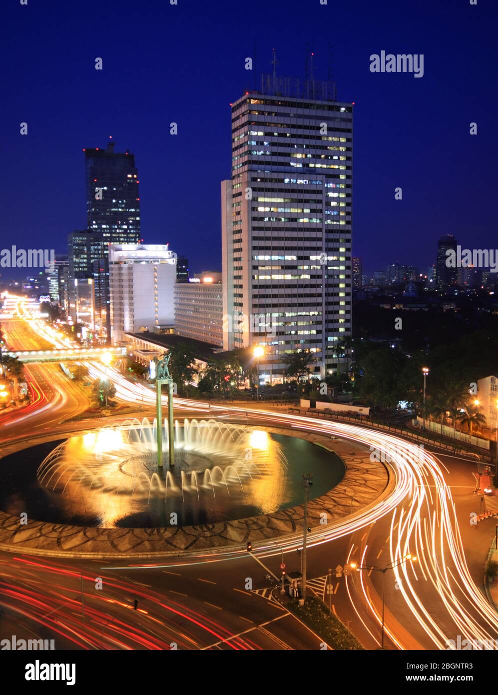 Night time view of traffic in the center of business district in Jakarta Stock Photo