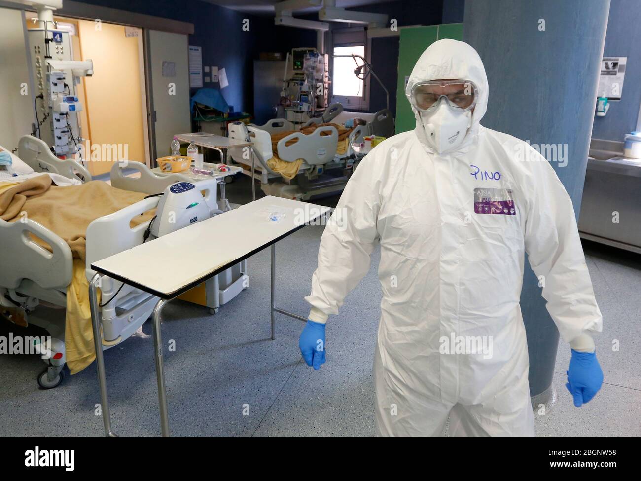 Rome, Italy. 19th Apr, 2020. A medical staffer wearing protective outfit assists patients in an Intensive Care unit's Covid-19 department at the San Filippo Neri hospital. Stock Photo